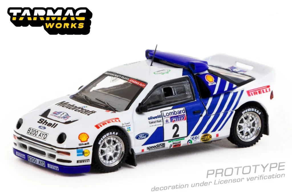 TARMAC WORKS 1:64 - 1986 Ford RS200 Lombard RAC Rally #2 Stig Blomqvist/Bruno Berglund, white/blue -