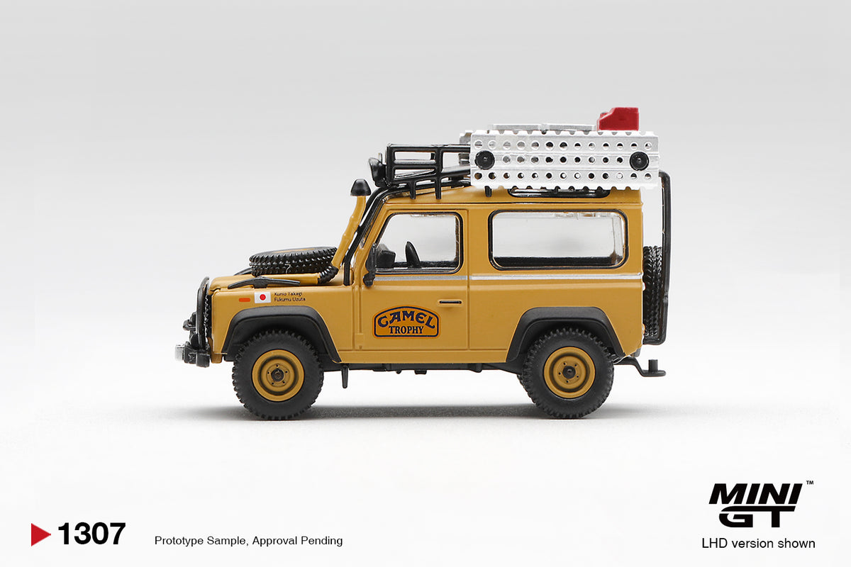 Mini GT 1:64 Diecast - LAND ROVER DEFENDER 90 1985 CAMEL TROPHY BORNEO TEAM JAPAN (LHD), Yellow - MGT01307-L