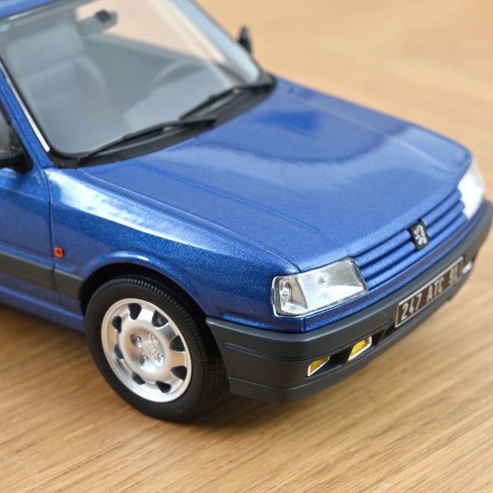 NoRev 1:18 Scale Diecast, 1991 Peugeot 309 GTi 16 in Miami Blue - 184881