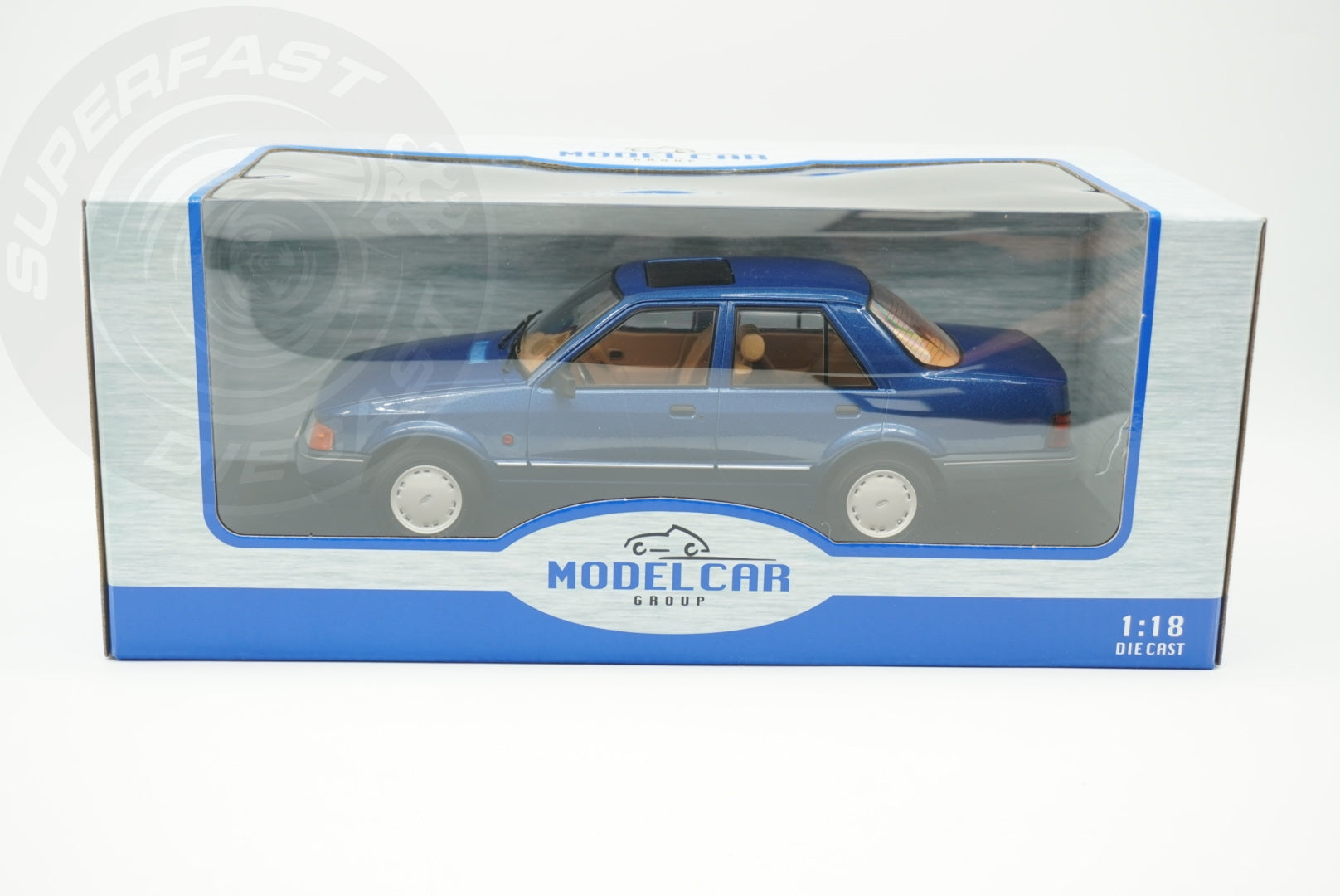 MCG 1:18 Scale Diecast - Ford Orion Mk II Basic Version LHD with Hub Caps, Blue - MCG18490