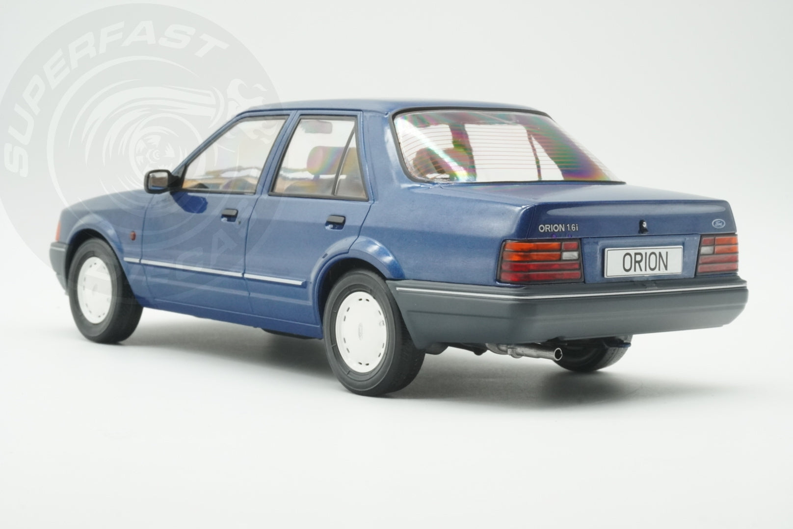 MCG 1:18 Scale Diecast - Ford Orion Mk II Basic Version LHD with Hub Caps, Blue - MCG18490