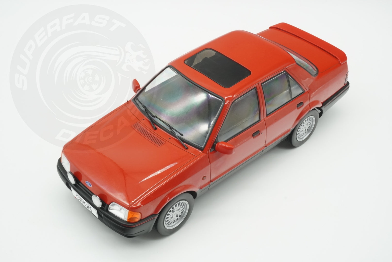 MCG 1:18 Scale Diecast - Ford Orion Mk II 1600E LHD with Multispoke Alloys, Red - MCG18488