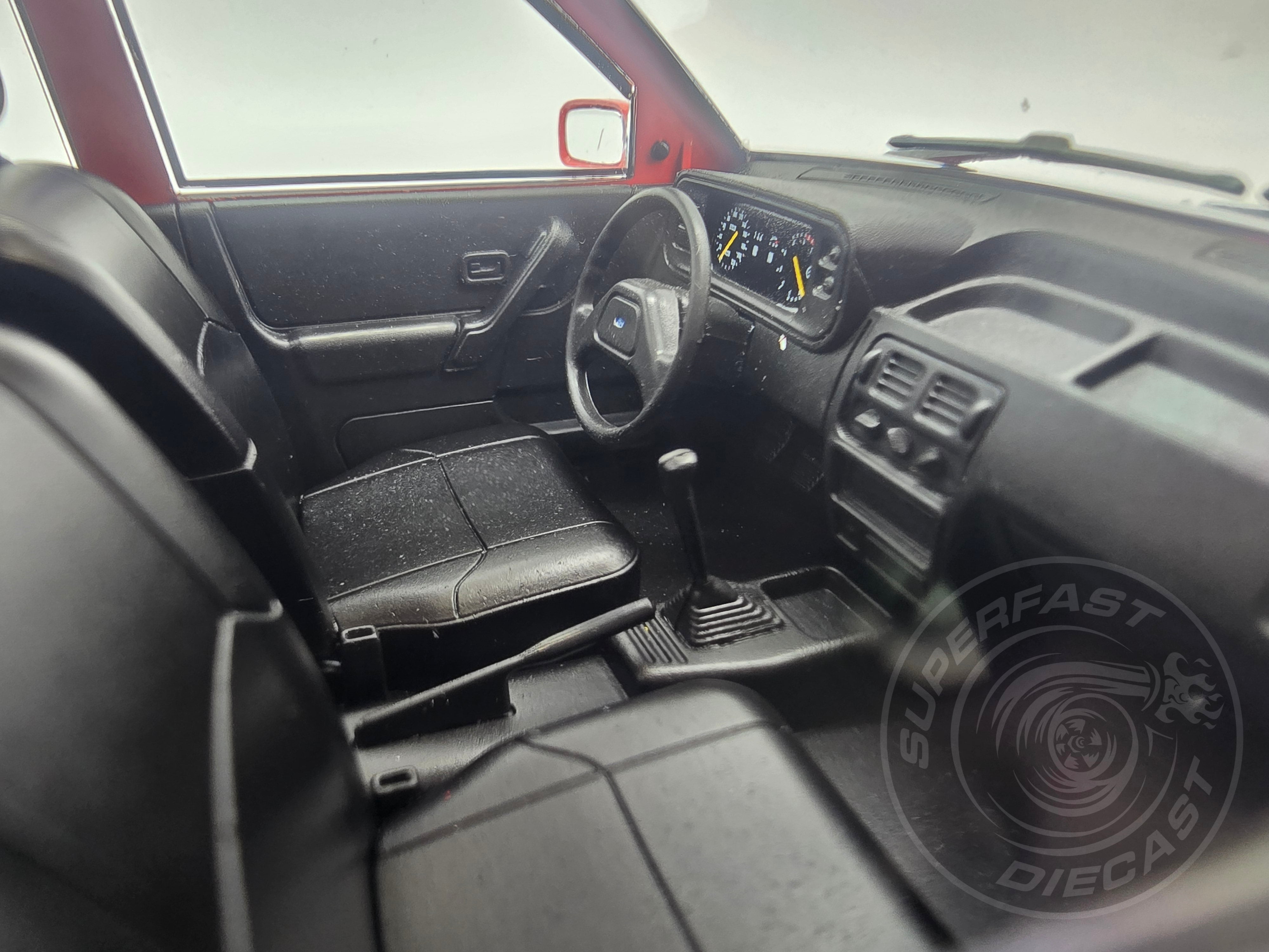 MCG 1:18 Scale Diecast - Ford Orion Mk II 1600E LHD with Multispoke Alloys, Red - MCG18488