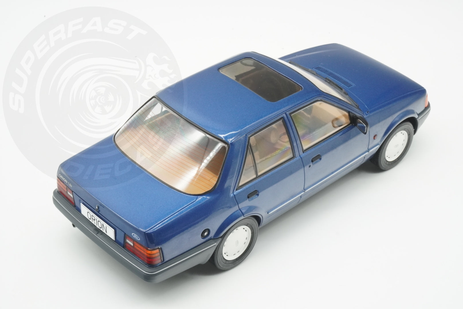 MCG 1:18 Scale Diecast - Ford Orion Mk II Basic Version LHD with Hub Caps, Blue - MCG18490
