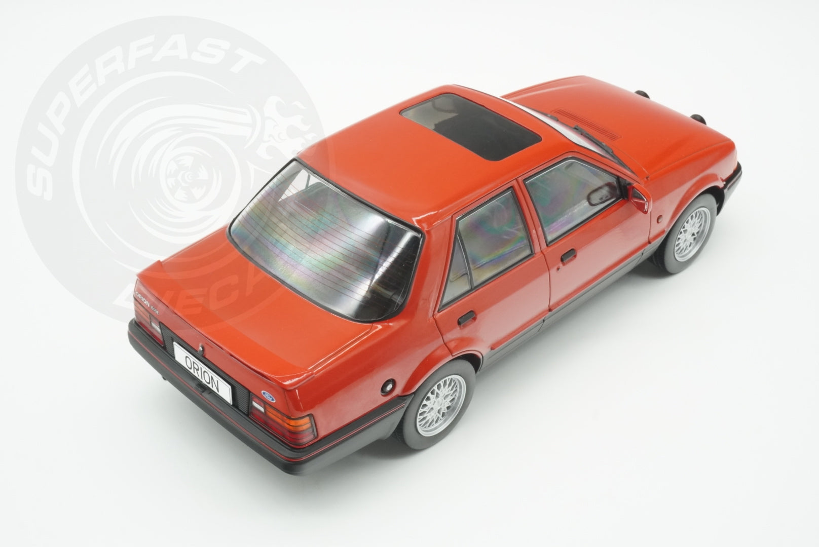 MCG 1:18 Scale Diecast - Ford Orion Mk II 1600E LHD with Multispoke Alloys, Red - MCG18488