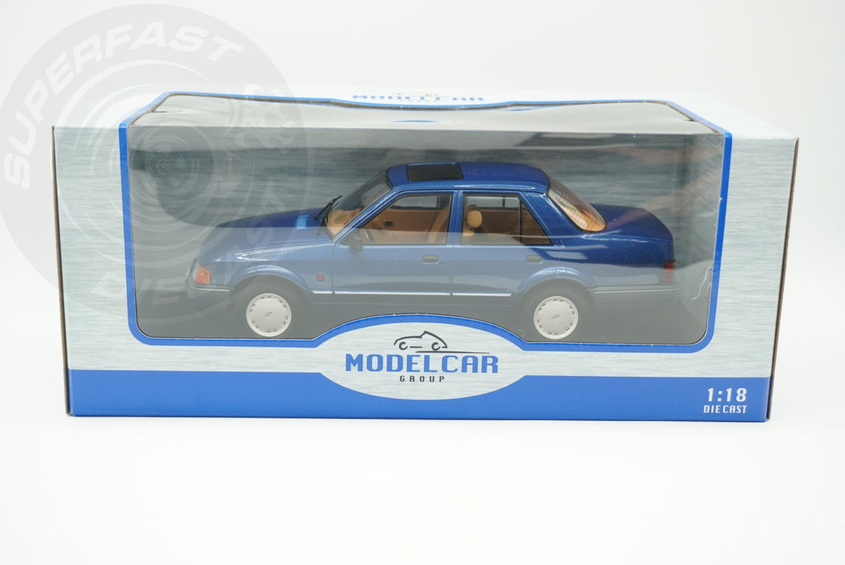 MCG 1:18 Scale Diecast - Ford Orion Mk II Basic Version LHD with Hub Caps, Blue - MCG18490