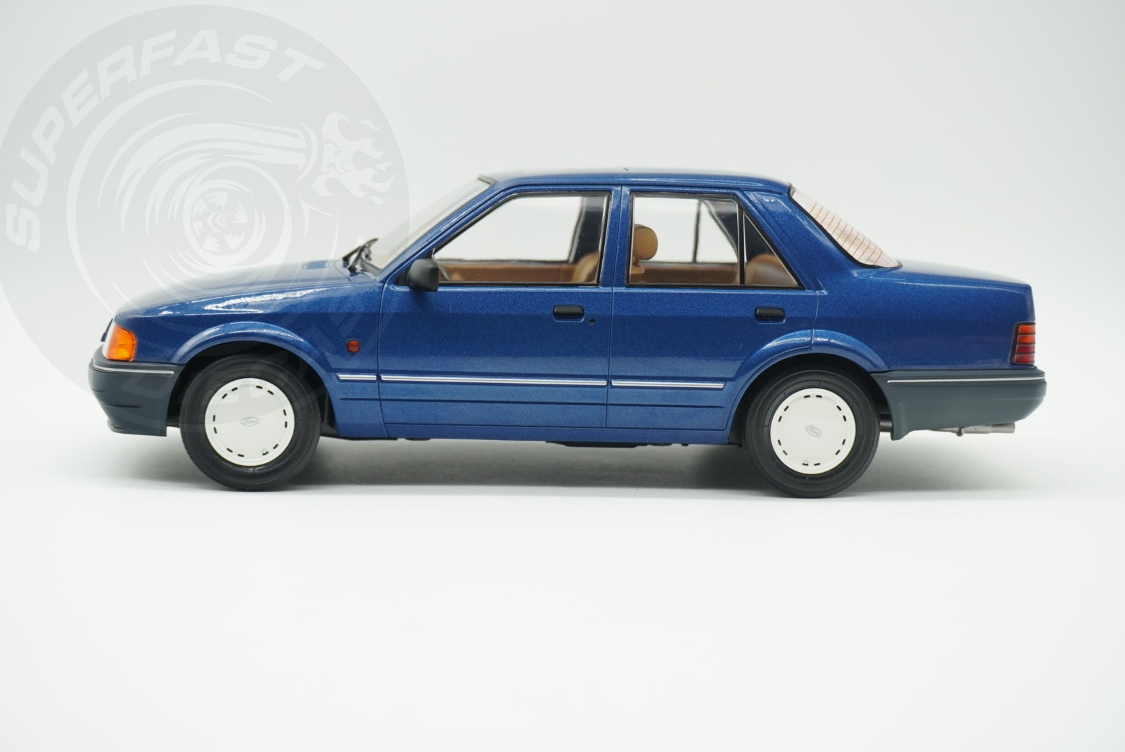 MCG 1:18 Scale Diecast - Ford Orion Mk II Basic Version LHD with Hub Caps, Blue - MCG18490